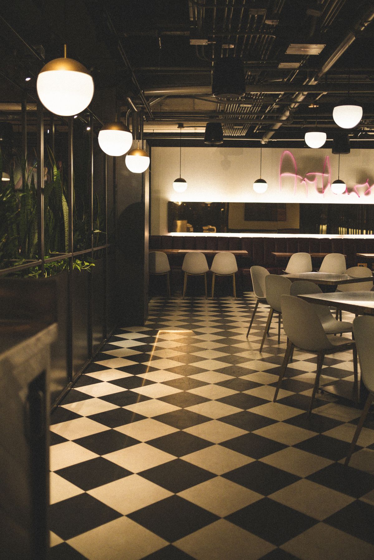 Illustrative restaurant interior with a chequered hard floor